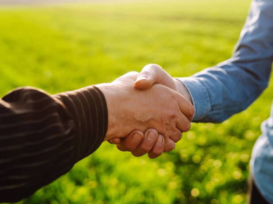 A handshake between a farmer and a supplier