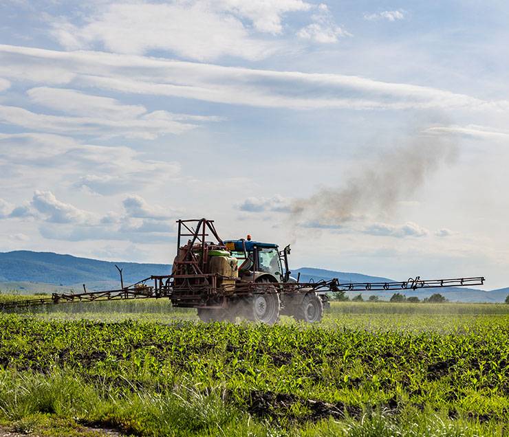 A farm sprayer working in the field