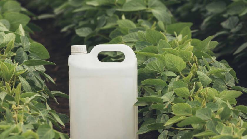 Image of a nutrient container in the a crop field